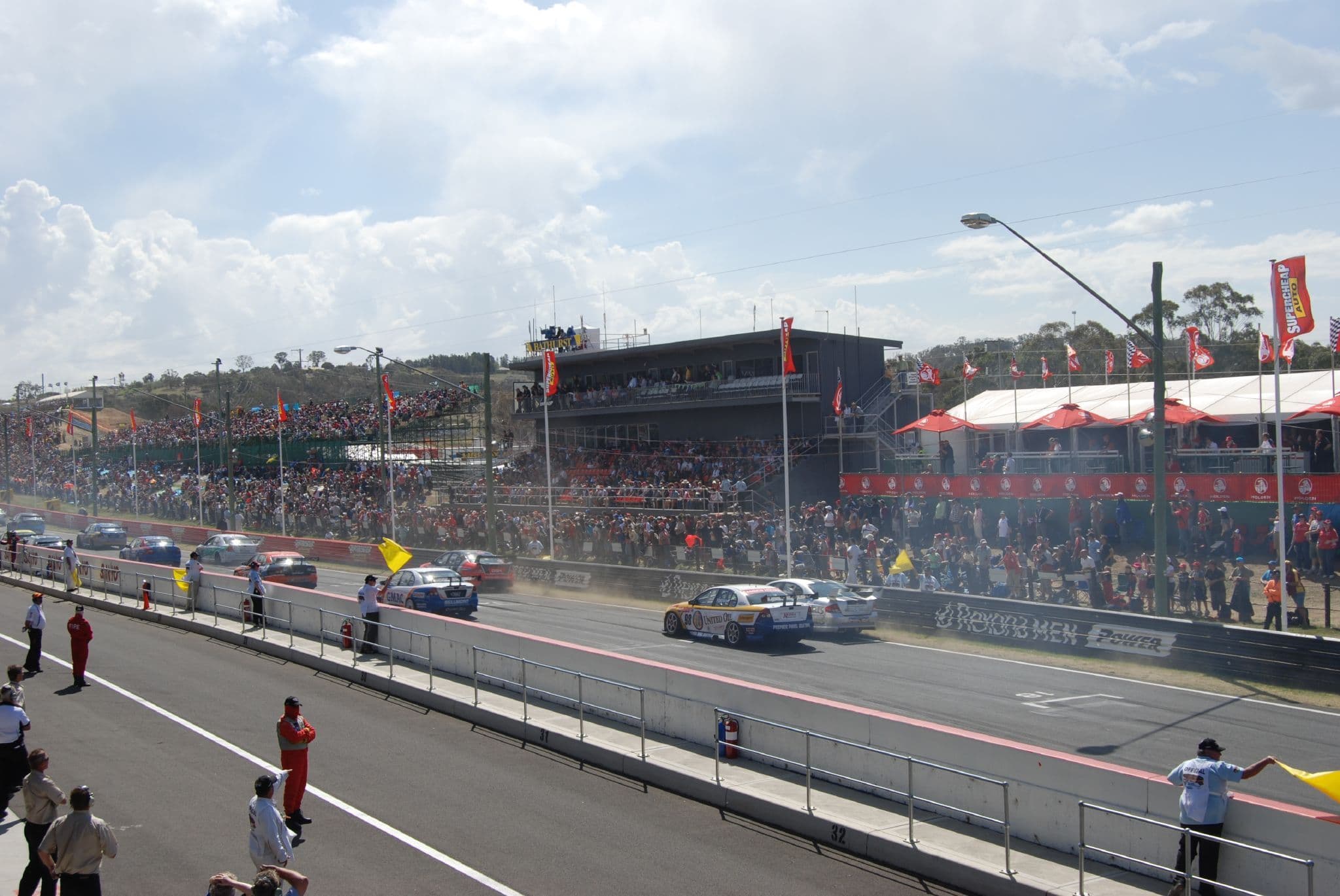 A pack of Supercars racing nose to tail at the Bathurst 1000.