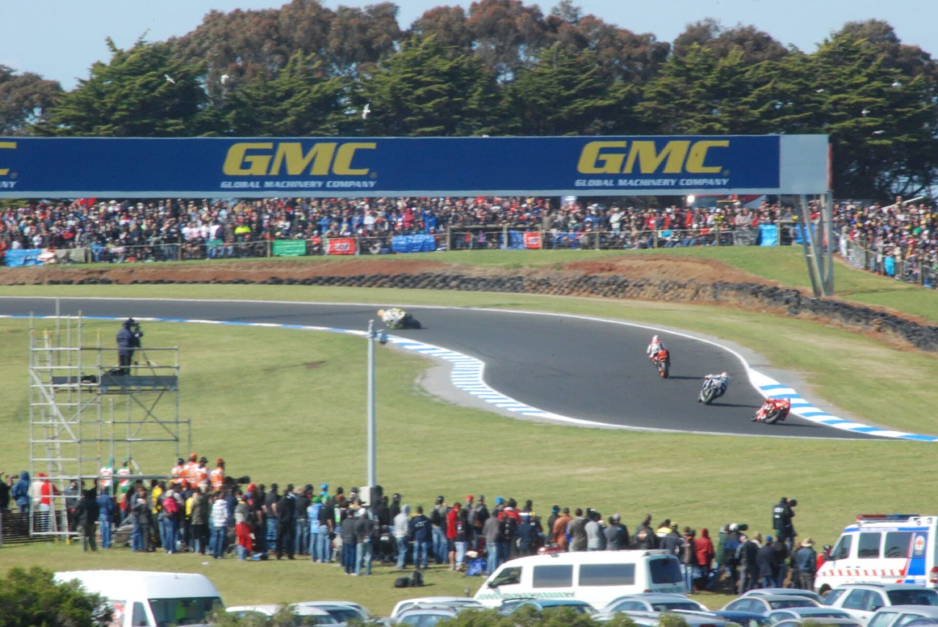 Racing motorcycles leaning through MG corner at Phillip Island during the 2007 Australian Grand Prix.
