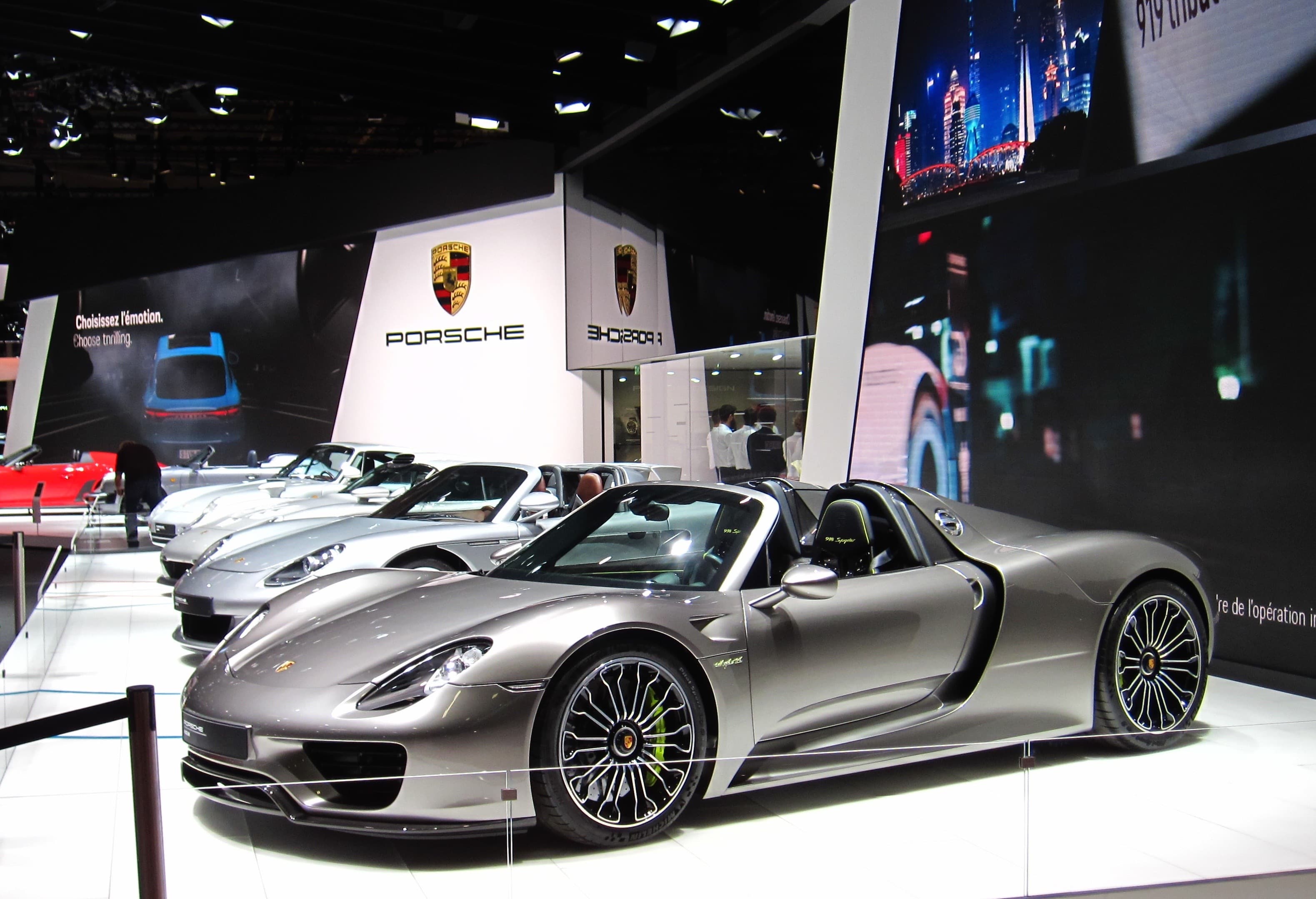 Silver Porsche 918 Spyder at the 2018 Paris Motor Show, showing the sculpted rear haunches and active aerodynamics