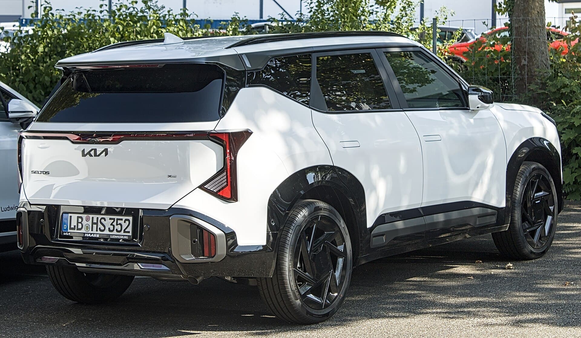 A new-generation Kia Seltos small SUV parked on a street in Ludwigsburg, Germany.